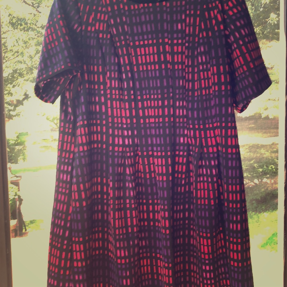 Short sleeve A-line dress with a simple pattern.